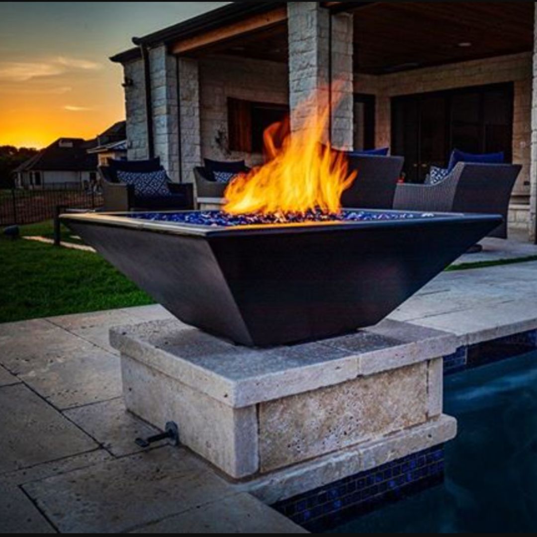 Luxury outdoor fire bowl beside modern patio seating