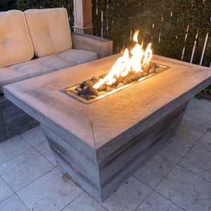 The Outdoor Plus Carson Wood Grain Concrete Fire Pit.