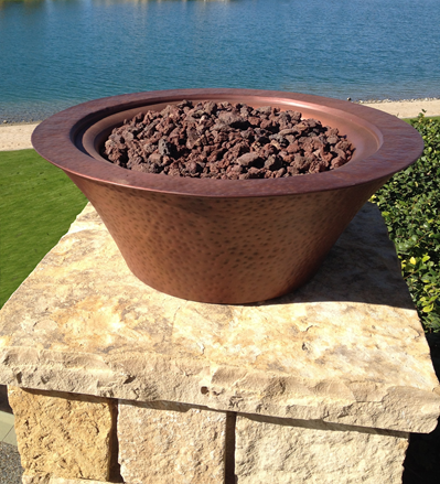 The Outdoor Plus Cazo Hammered Copper Fire Bowl.